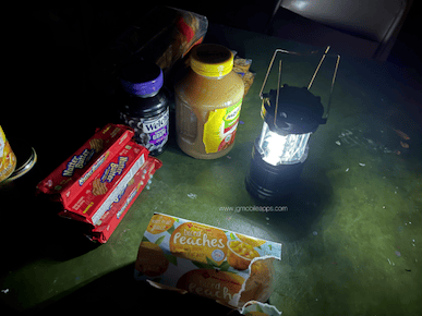 A picture of inside our home during the Texas blackout without electricity. Showing a battery flashlight with limited snacks available at the time.